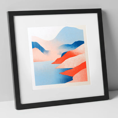 Graphic Buttermere in Coral and Blue lake district lake art print in black frame