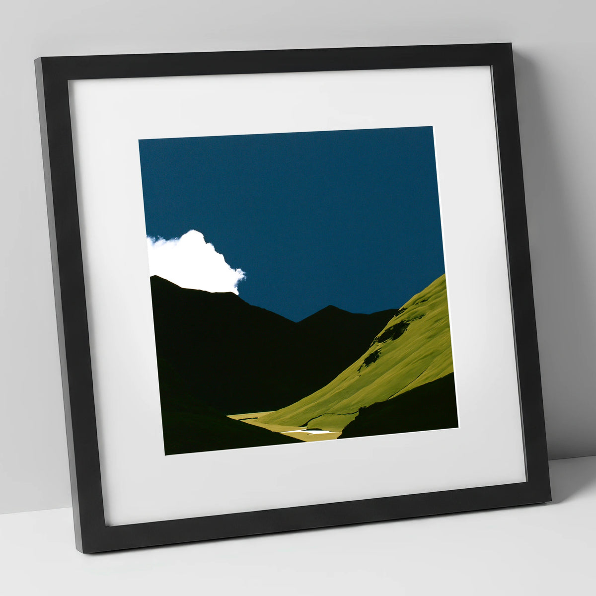Sunlit Fell Under Storm Cloud lake district sky art print in black frame