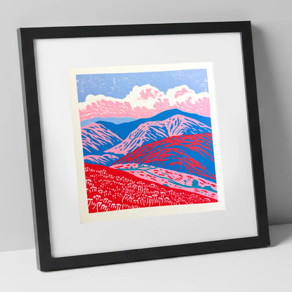 Red and Blue Rolling Fells lake district fell art print in black frame
