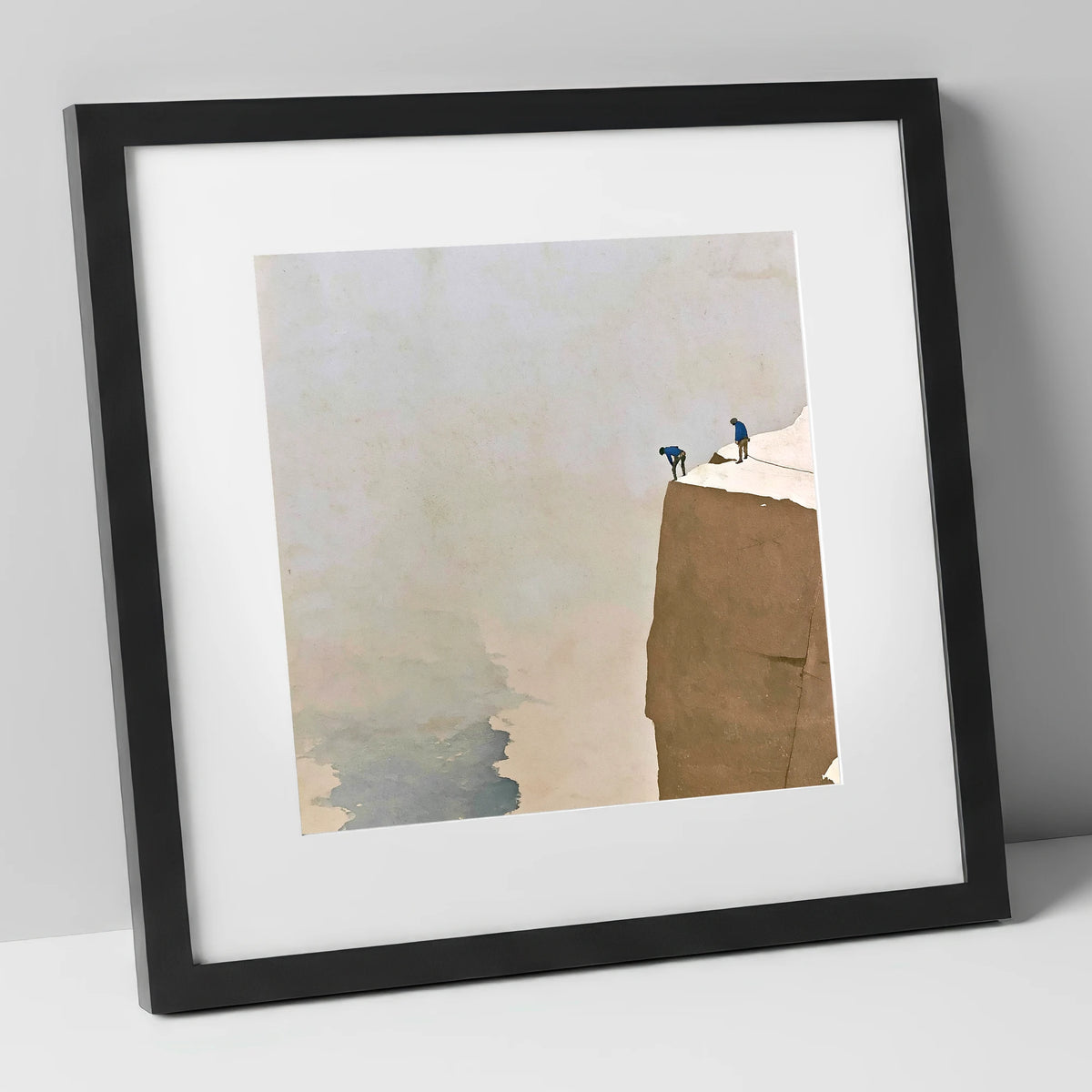 Climbers on a Snowy Crag lake district walking art print in black frame