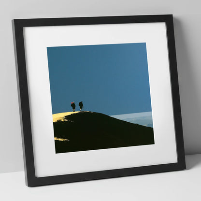 Silhouetted Hikers on a Fell Top lake district fell art print in black frame