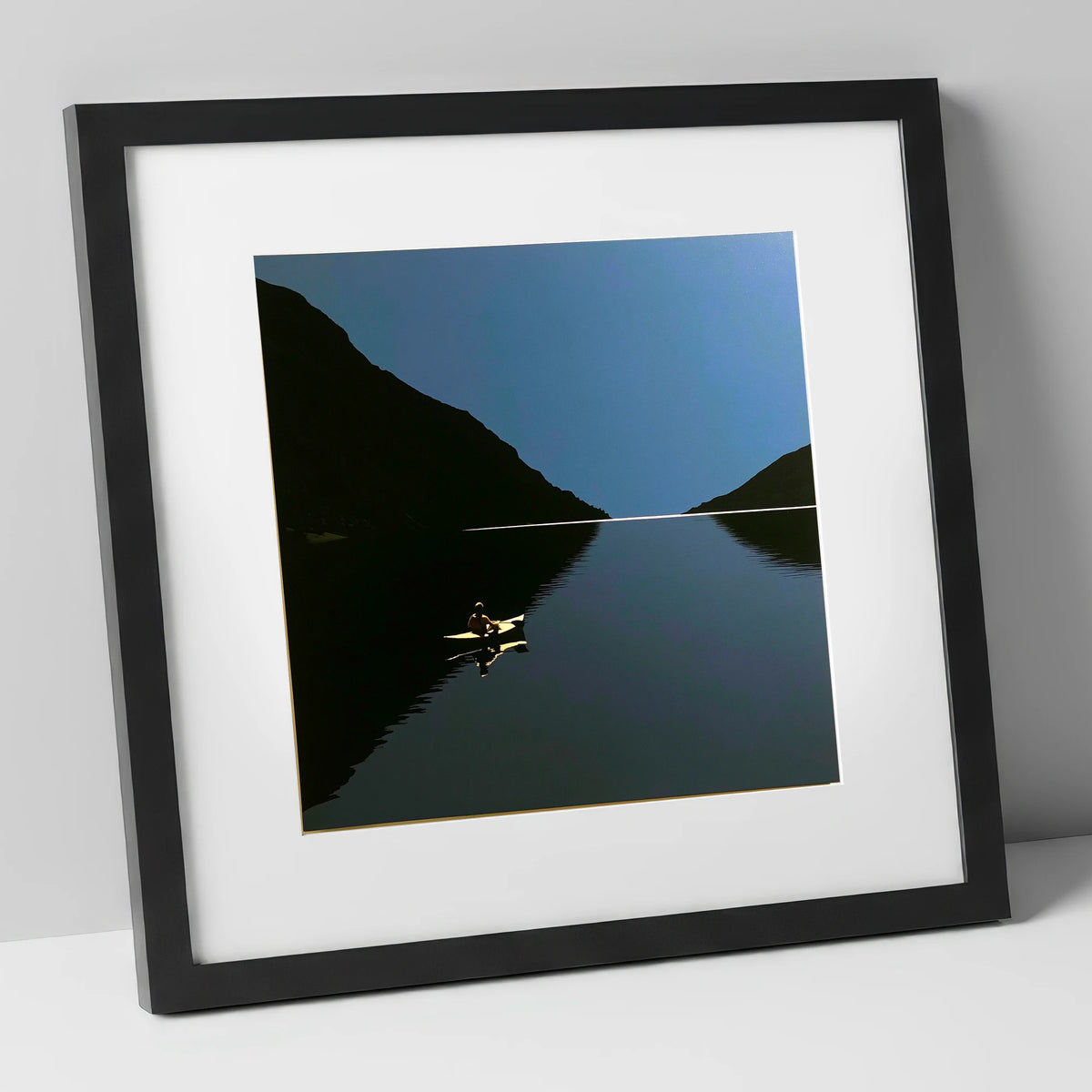 Illuminated Kayak on Dark Lake lake district walking art print in black frame