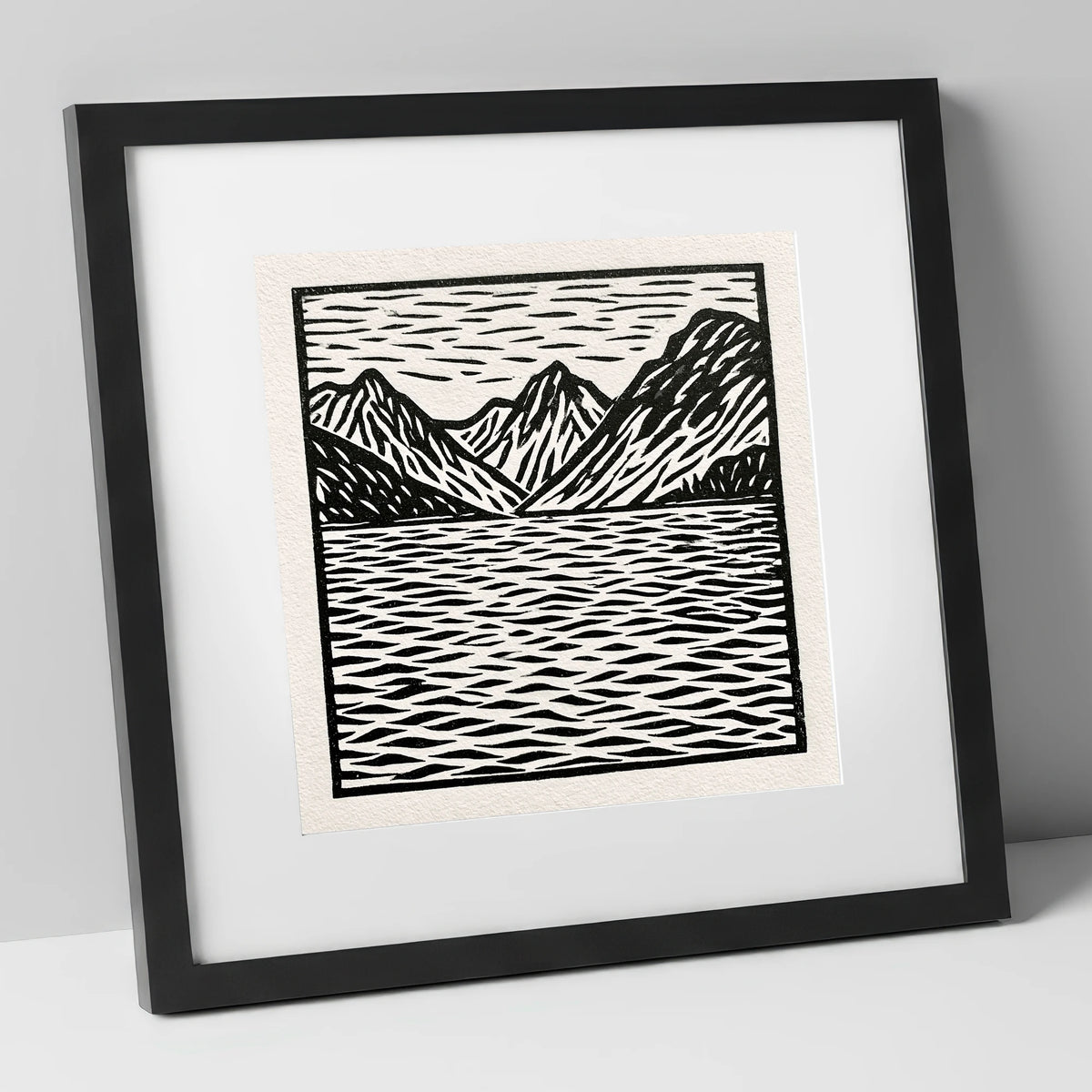 Monochrome Fells and Lake Reflections lake district lake art print in black frame