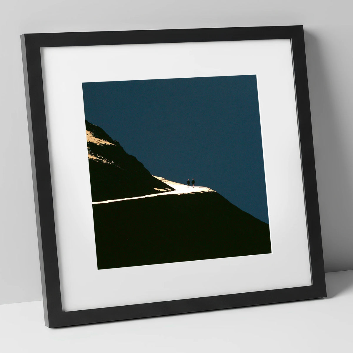 Fell Walkers On An Illuminated Path lake district walking art print in black frame