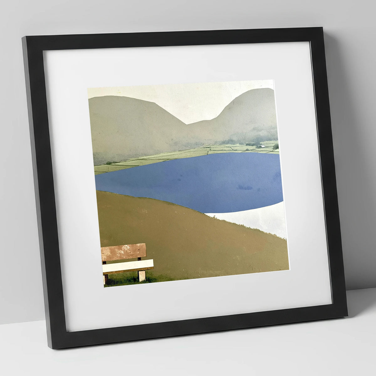 Bench Above Slate Blue Loweswater lake district lake art print in black frame