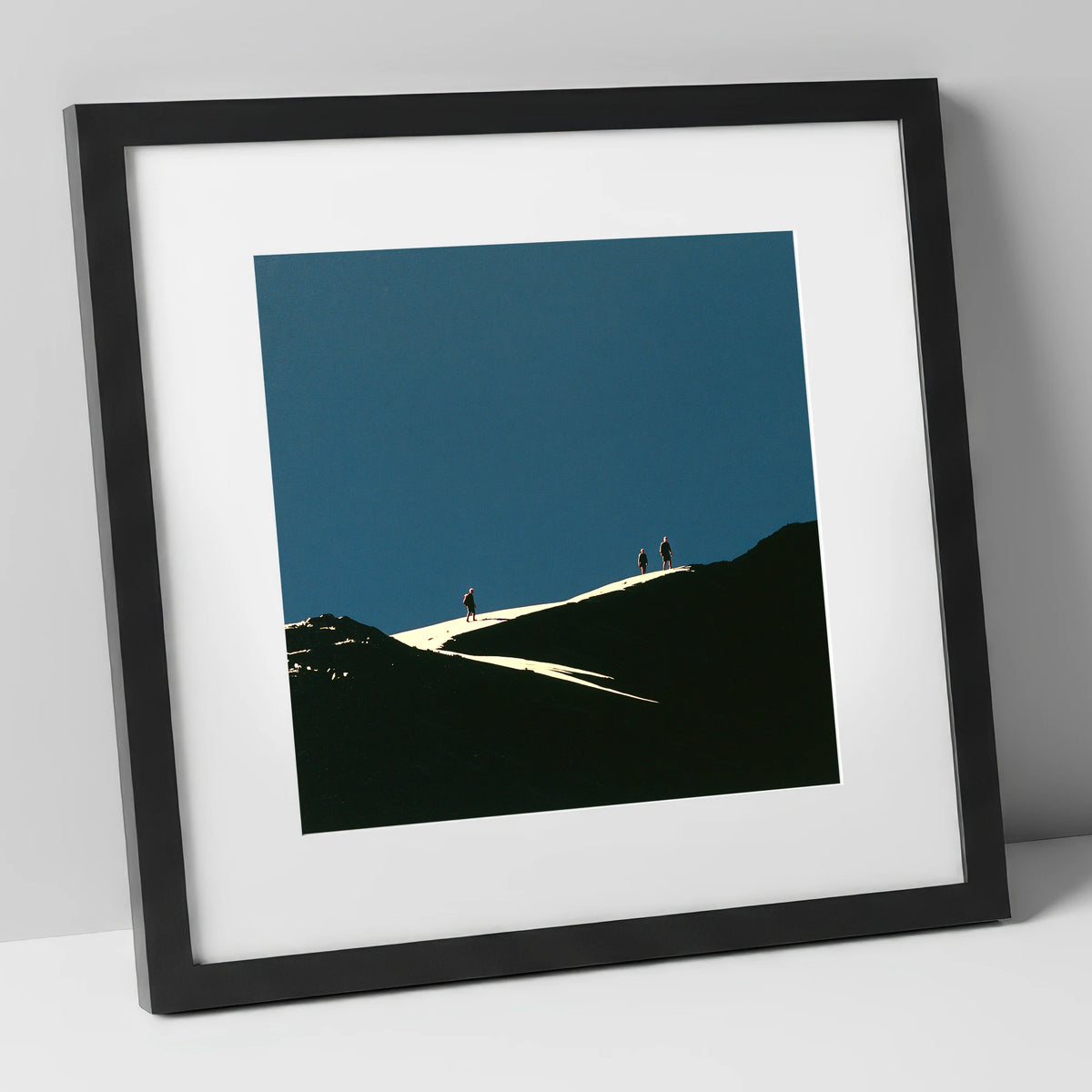 Hikers on a Sunlit Ridge lake district fell art print in black frame