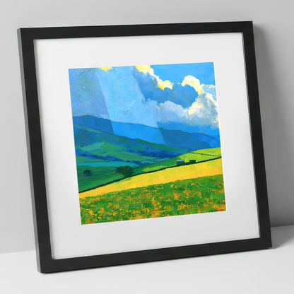 Sunlit Yellow Fields and Stormy Fells lake district sky art print in black frame