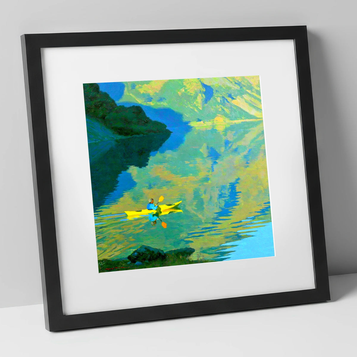 Yellow Kayak on Reflecting Fells lake district walking art print in black frame