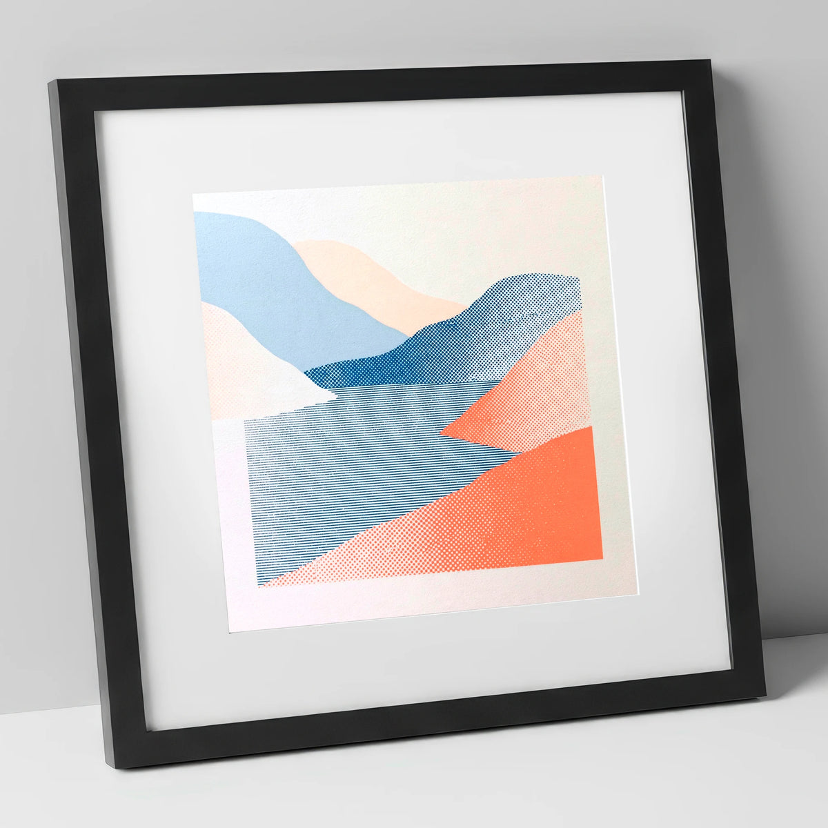 Graphic Coral and Blue Fells lake district lake art print in black frame