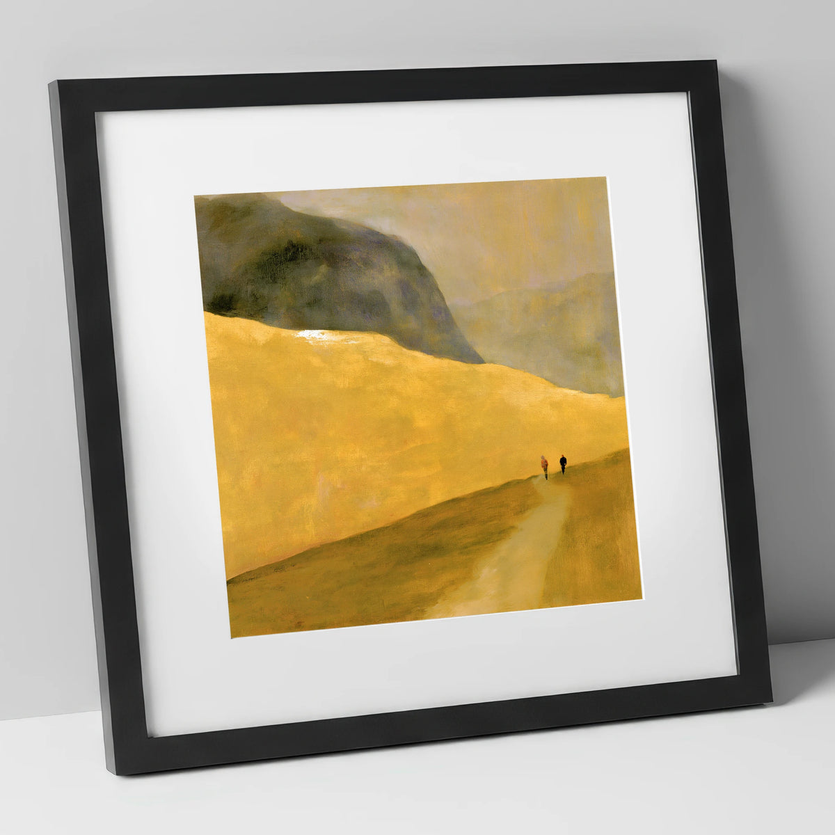 Walkers on a Golden Fell lake district walking art print in black frame