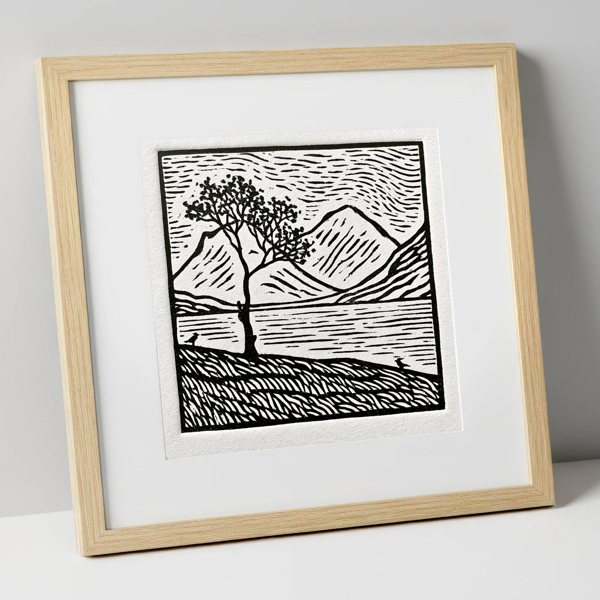 Monochrome Buttermere and Lone Tree lake district lake art print in natural frame