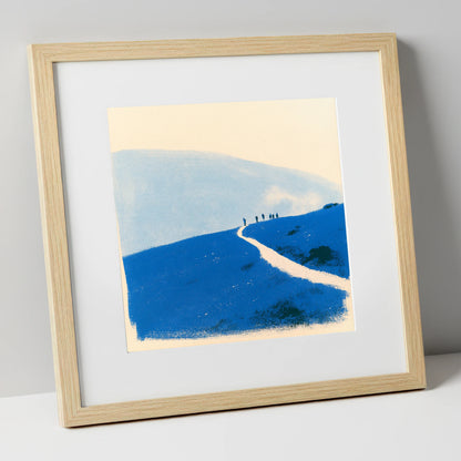 Walkers on a Blue Mountain Path lake district walking art print in natural frame