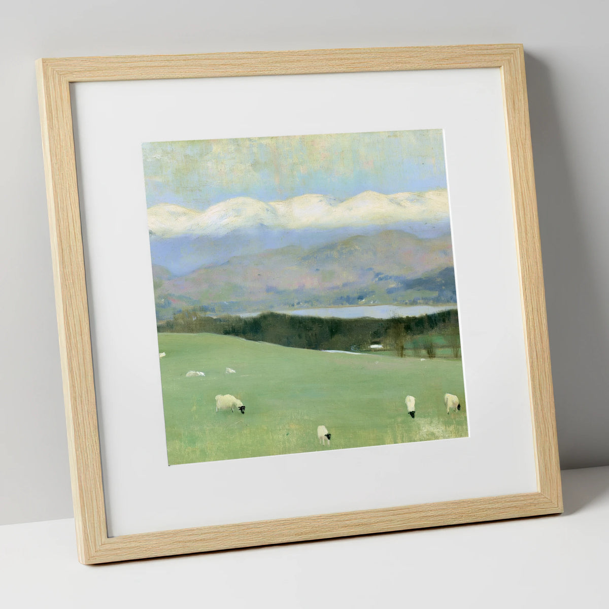 Hawkshead Pastures and Snow-Capped Fells lake district village art print in natural frame