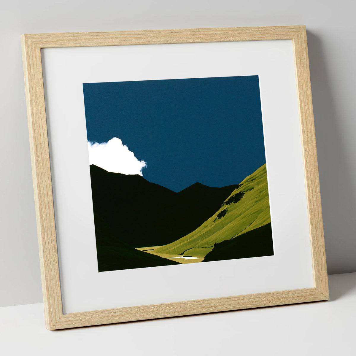 Sunlit Fell Under Storm Cloud lake district sky art print in natural frame