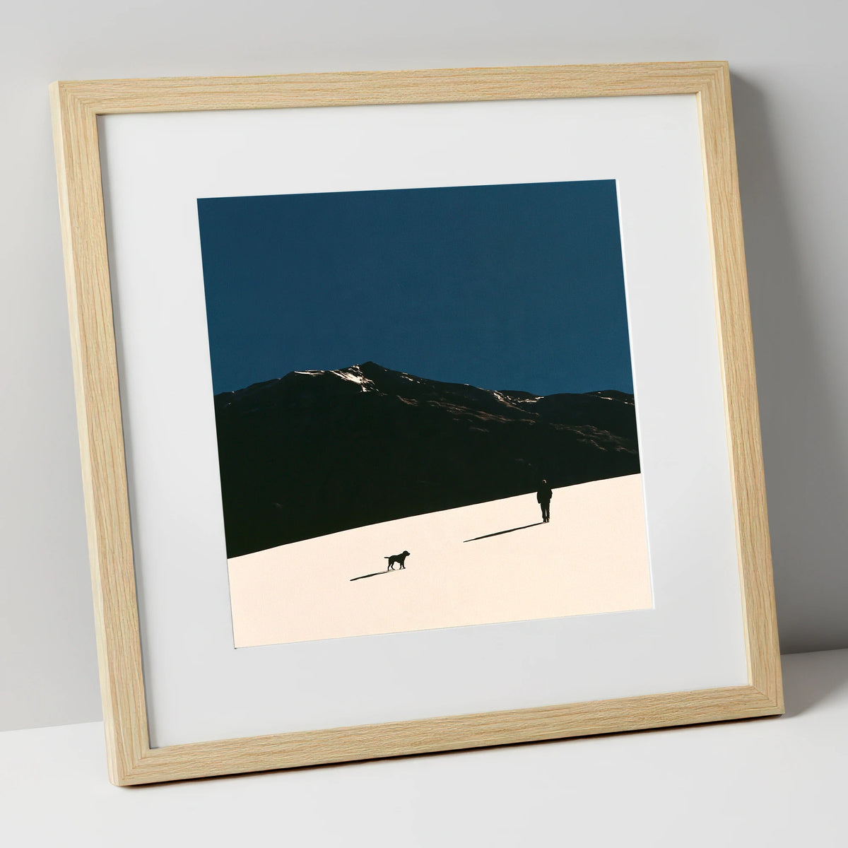 Silhouetted Dog Walker on Skiddaw gifts for dog walkers art print in natural frame