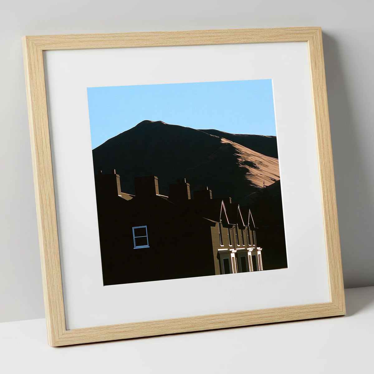 Silhouetted Keswick Terraces Beneath Skiddaw lake district village art print in natural frame
