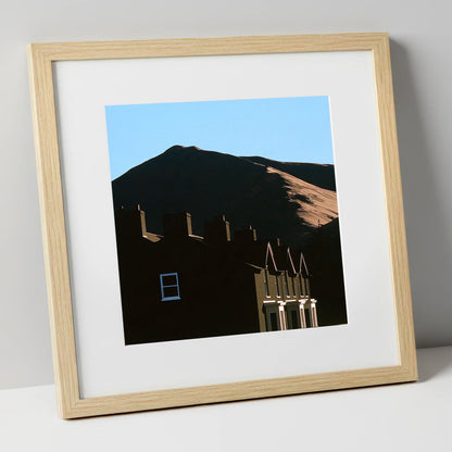Silhouetted Keswick Terraces Beneath Skiddaw lake district village art print in natural frame