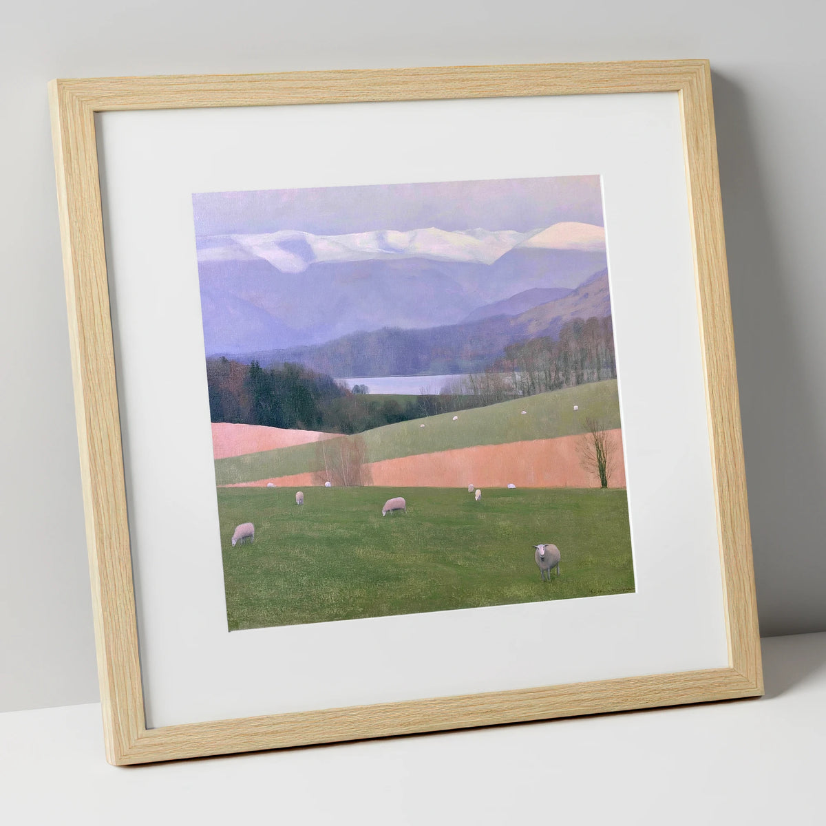 Hawkshead Pastures and Snowy Fells lake district village art print in natural frame