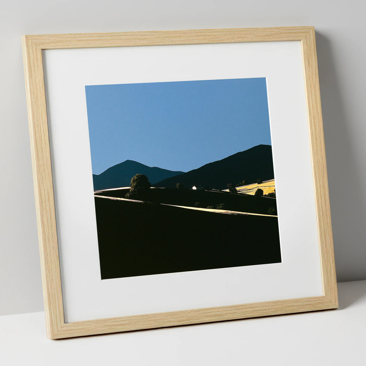 Golden Light on Silhouetted Fells lake district sky art print in natural frame