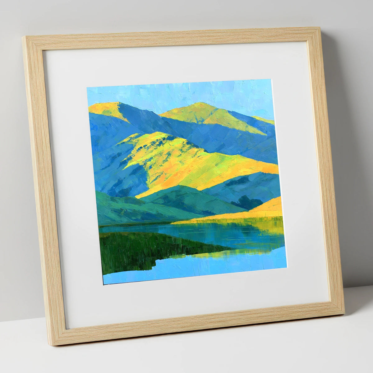 Sunlit Fells and Deep Blue Shadows lake district sky art print in natural frame
