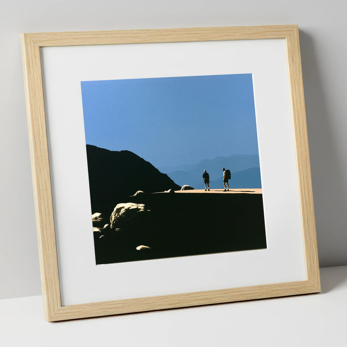 Hikers on a Sunlit Fell Ridge lake district fell art print in natural frame