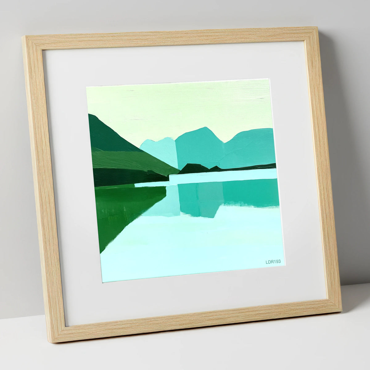 Loweswater Reflections in Bold Teal lake district lake art print in natural frame