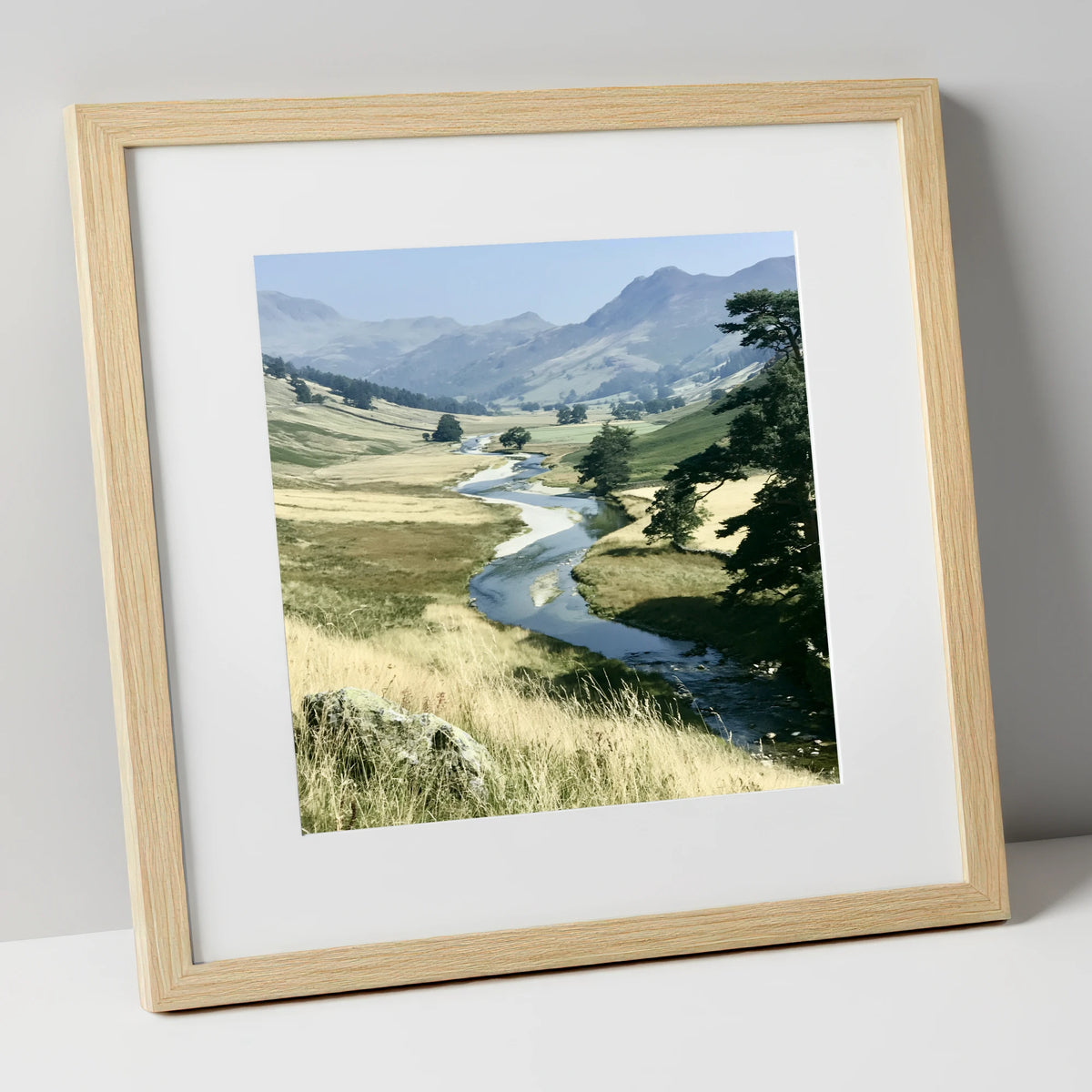 Winding River Beneath Hazy Fells lake district waterfall art print in natural frame