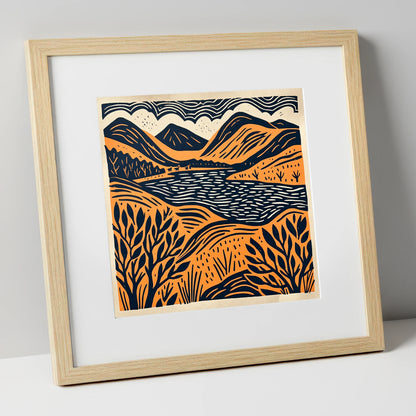 Terracotta and Navy Lake Fells lake district lake art print in natural frame