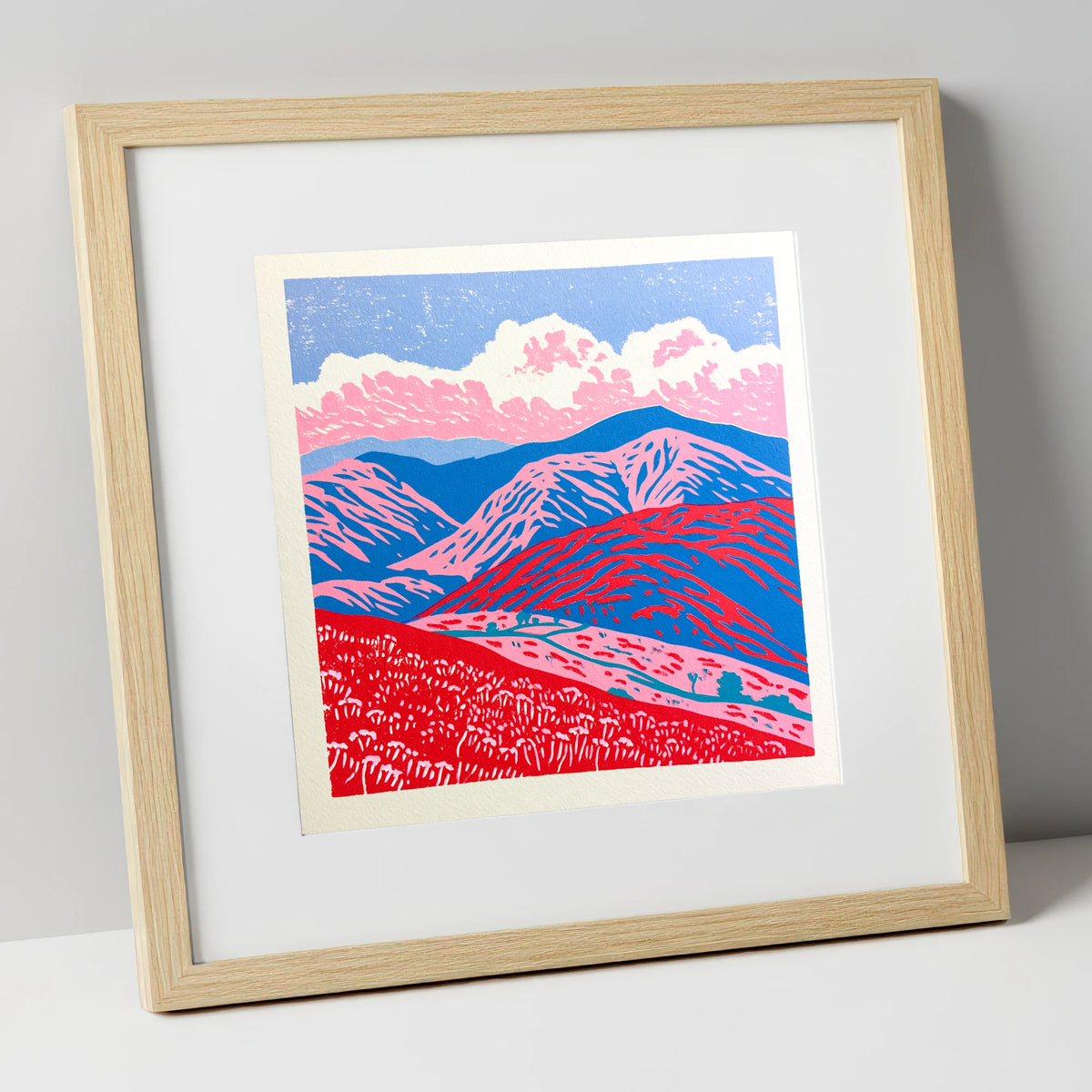 Red and Blue Rolling Fells lake district fell art print in natural frame