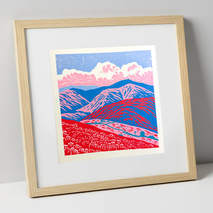 Red and Blue Rolling Fells lake district fell art print in natural frame