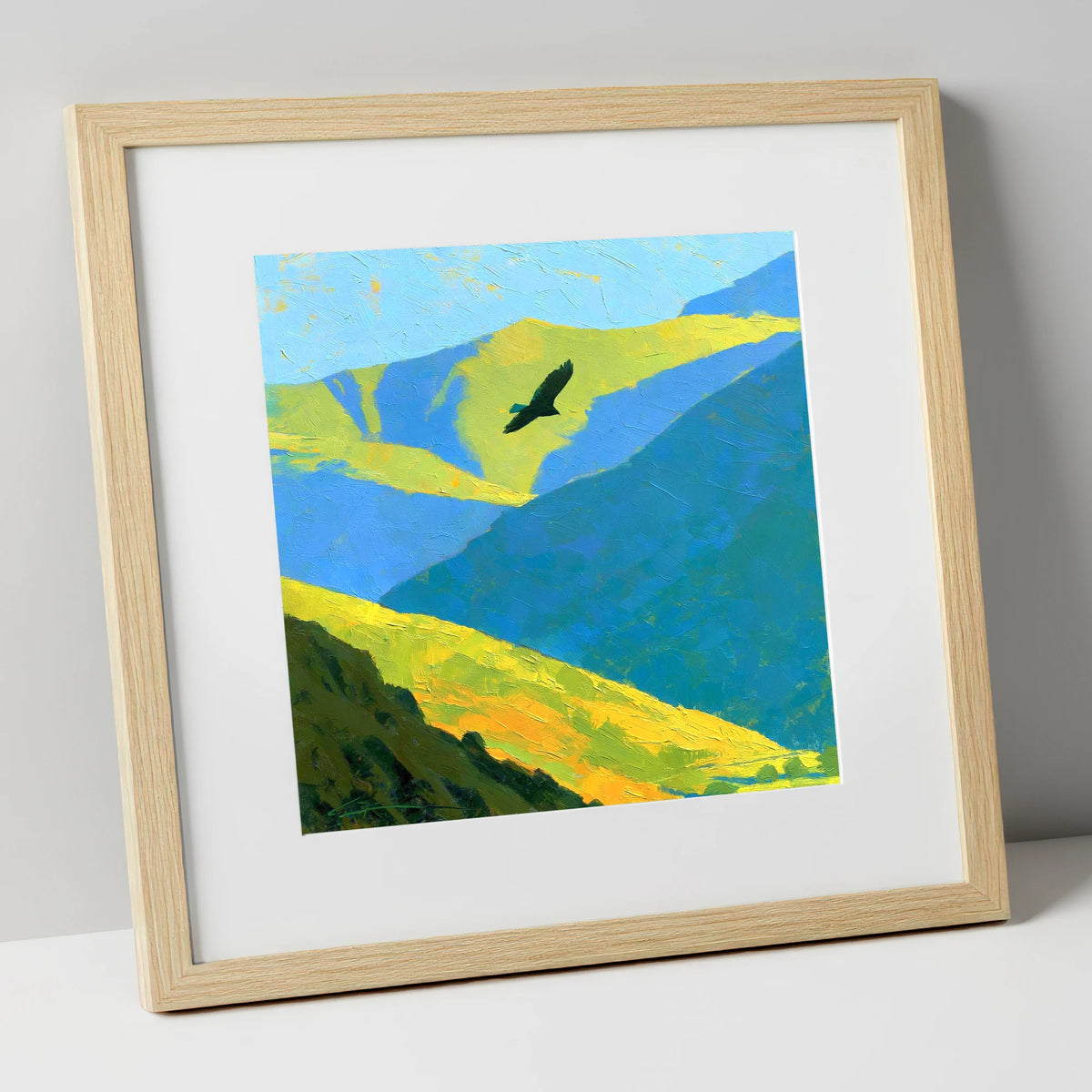 Soaring Bird of Prey Over Sunlit Fells lake district wildlife art print in natural frame
