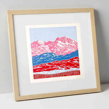 Bowfell in Bold Pink and Blue lake district fell art print in natural frame