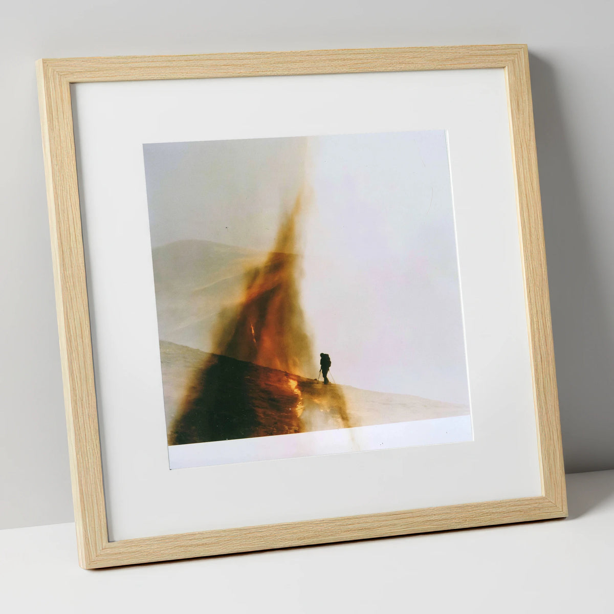 Fell-walker Silhouette in Amber Mist lake district walking art print in natural frame