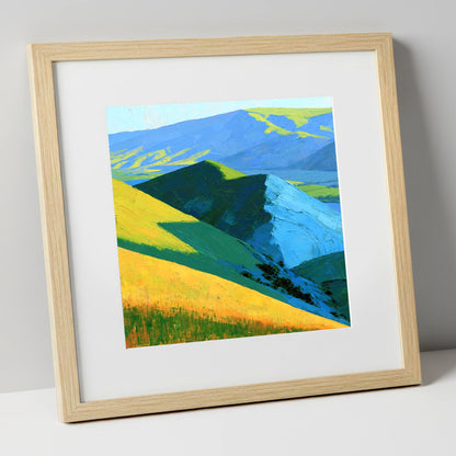 Vibrant Sunlit Fells and Deep Blue Shadows lake district sky art print in natural frame