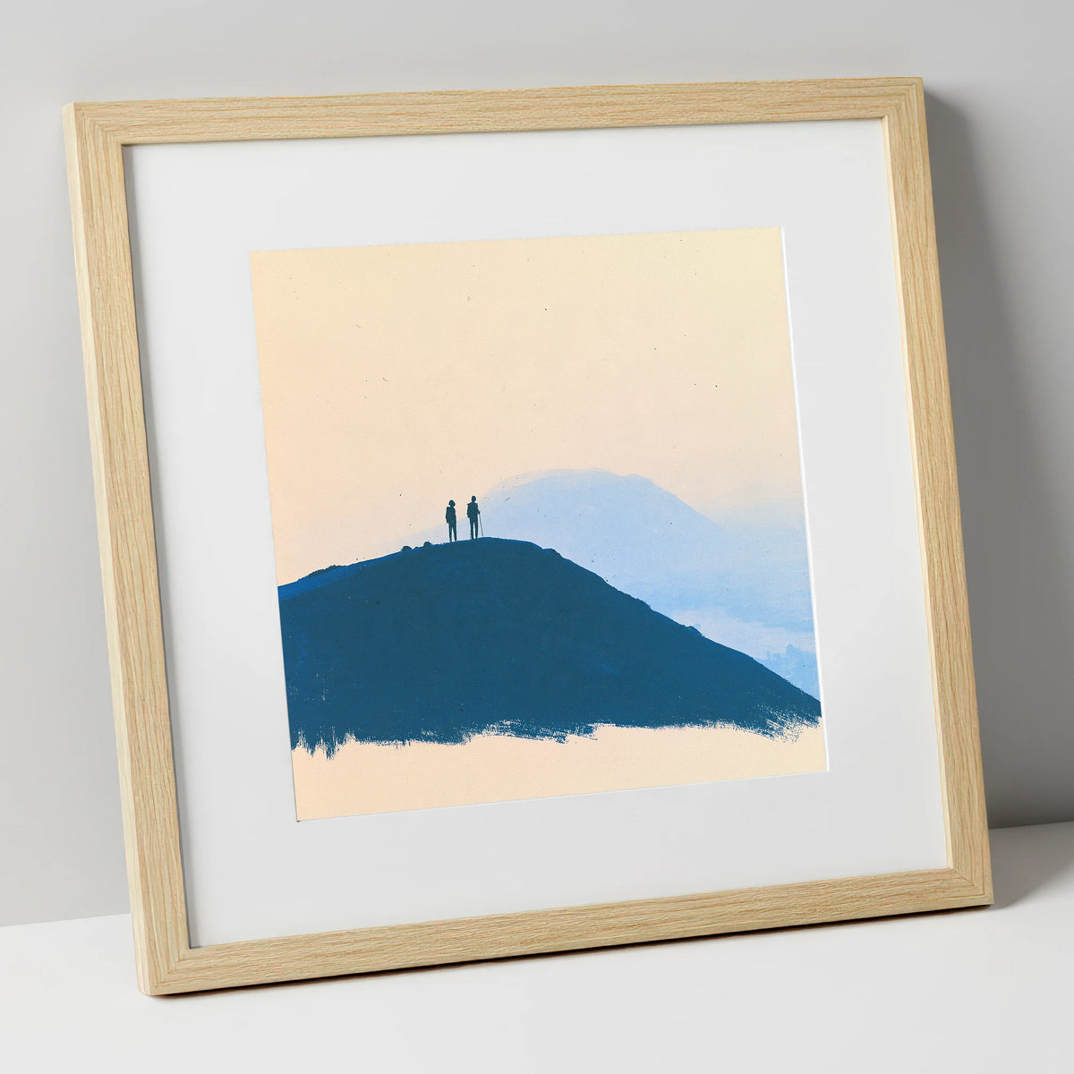 Silhouetted Hikers on Blue Fells lake district fell art print in natural frame