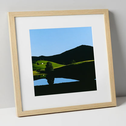 Sunlit Fells and Shadowed Peak lake district sky art print in natural frame