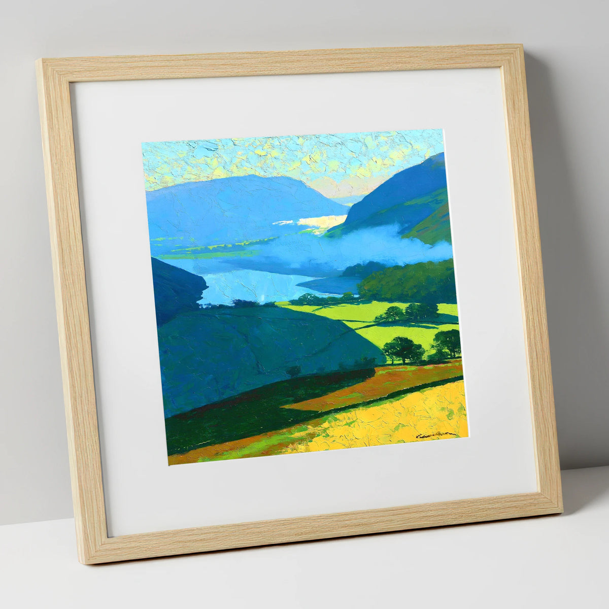 Misty Valley and Sunlit Lakeland Fields lake district sky art print in natural frame