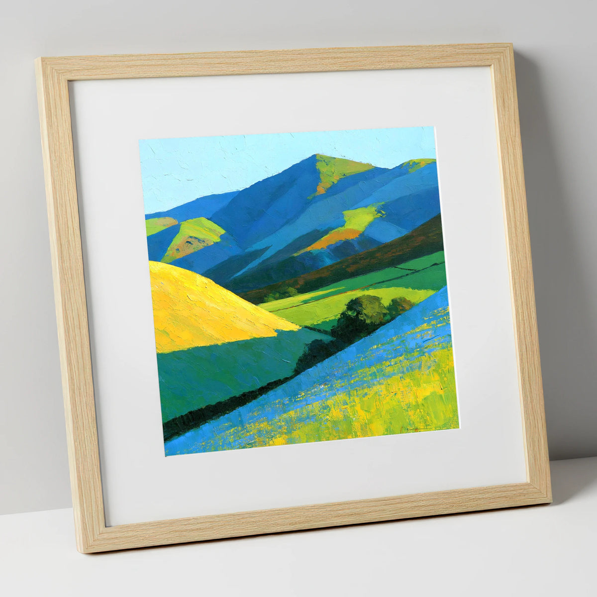 Vibrant Sunlight on Lakeland Fells lake district sky art print in natural frame