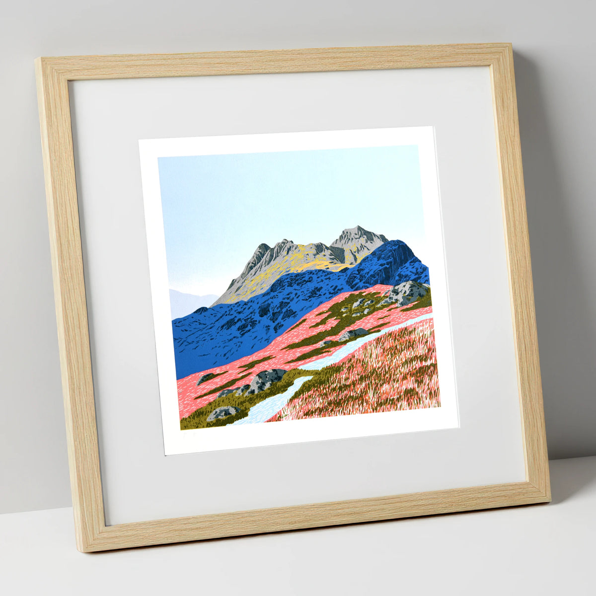 Langdale Pikes in Vivid Coral lake district fell art print in natural frame