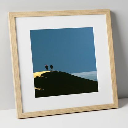 Silhouetted Hikers on a Fell Top lake district fell art print in natural frame