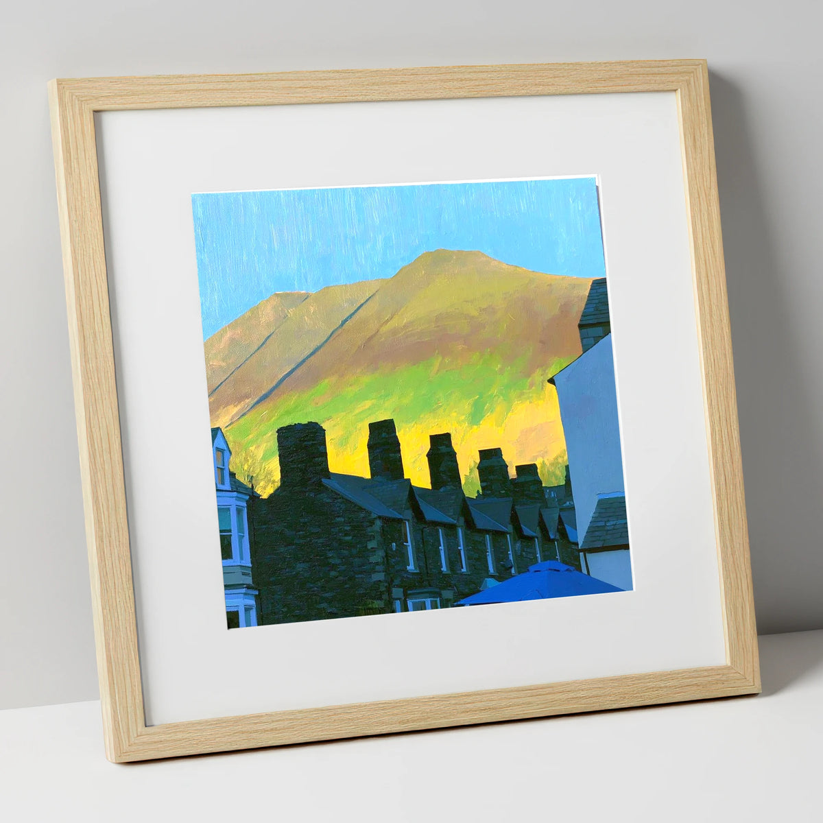 Keswick Chimneys and Sunlit Skiddaw lake district village art print in natural frame