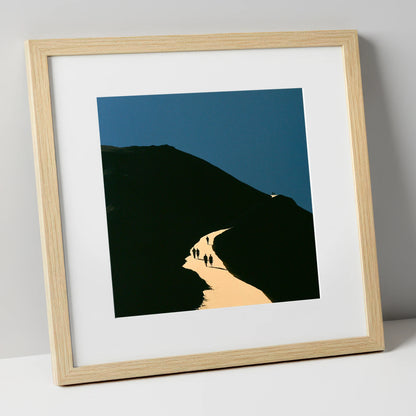 Walkers Ascending Luminous Fell Path lake district walking art print in natural frame
