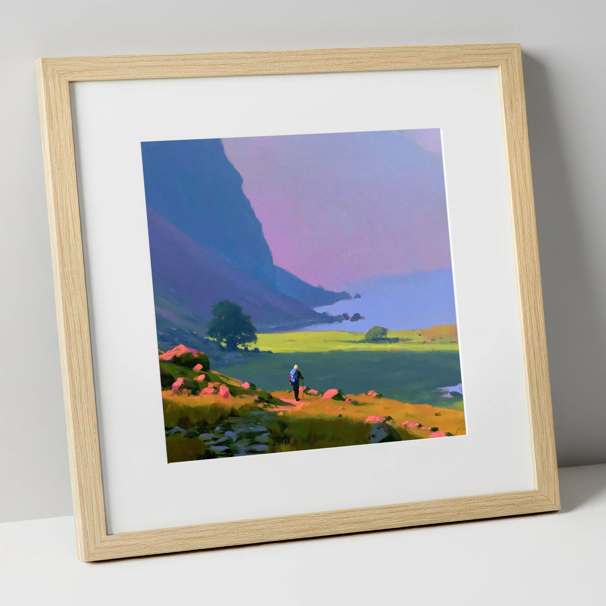Lone Hiker Beneath Indigo Fells lake district walking art print in natural frame