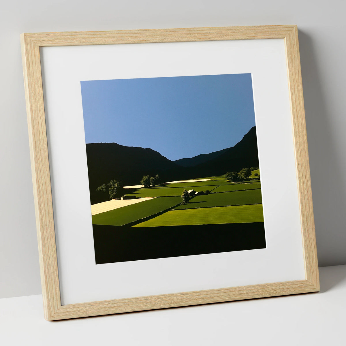 Sunlit Patchwork Fields in a Dale lake district valley art print in natural frame