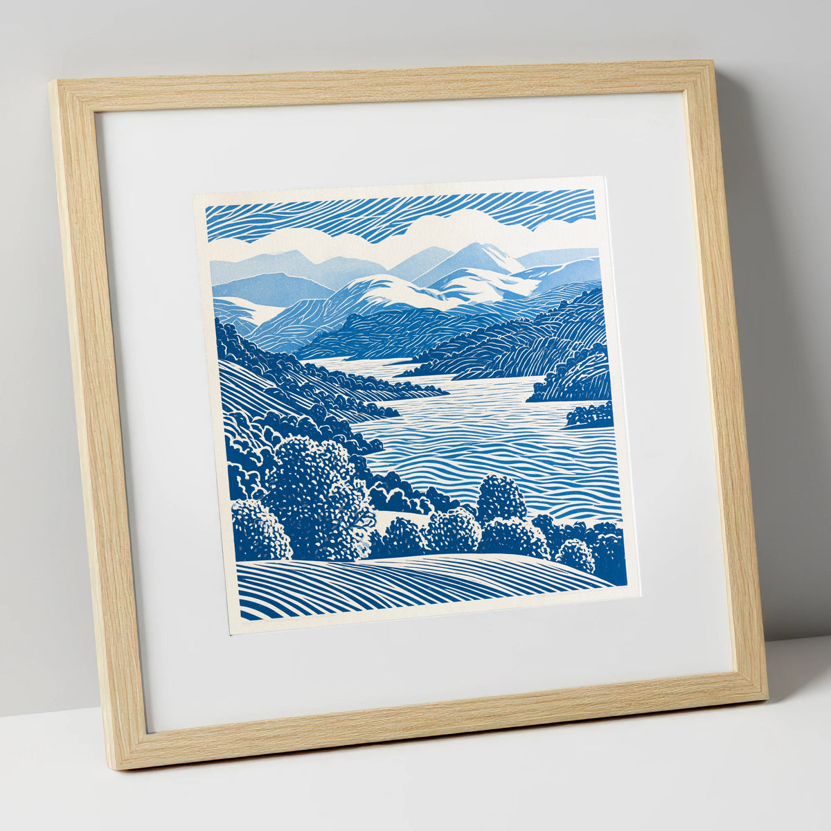 Coniston Water in Cobalt Blue lake district lake art print in natural frame