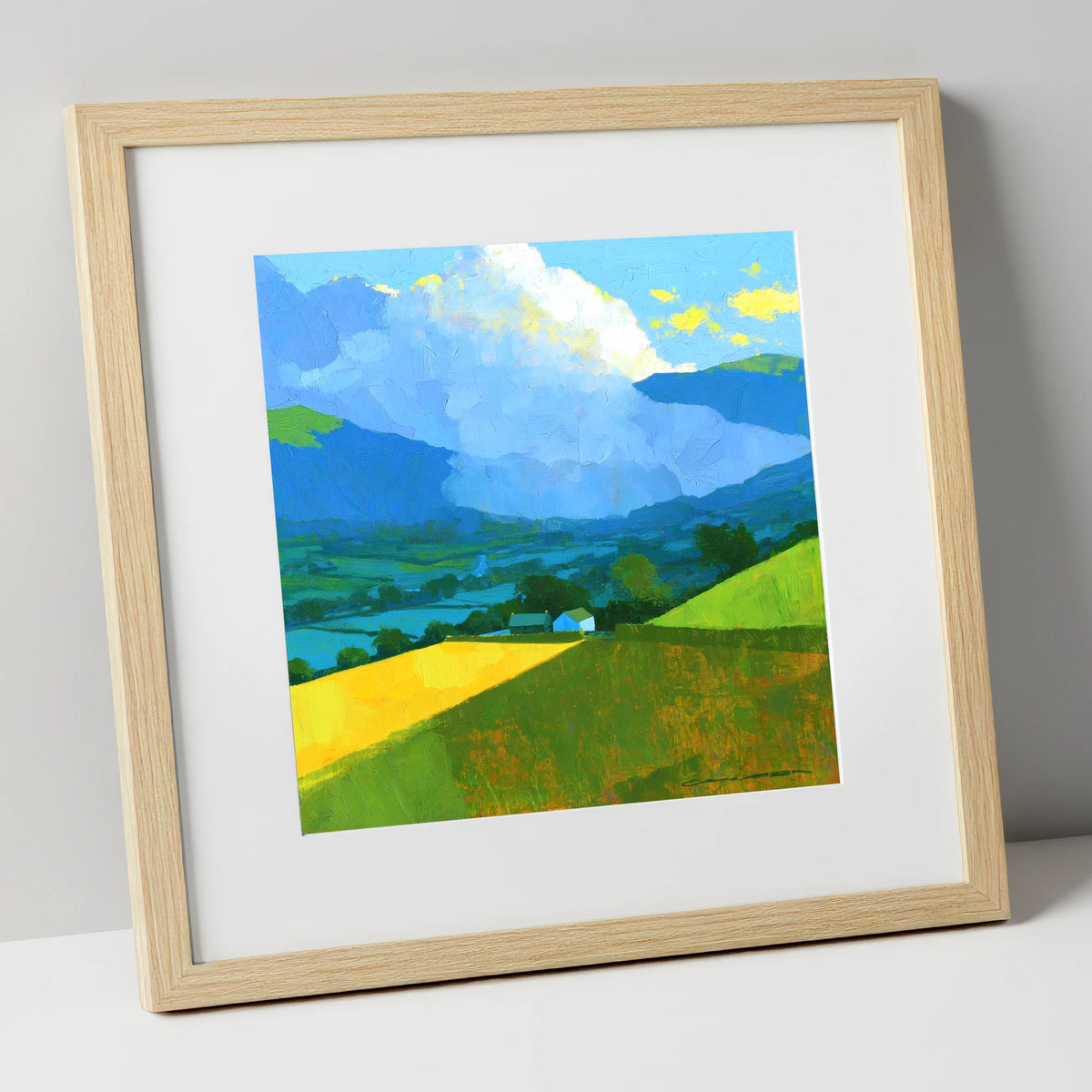 Vibrant Valley Fields and Towering Clouds lake district sky art print in natural frame