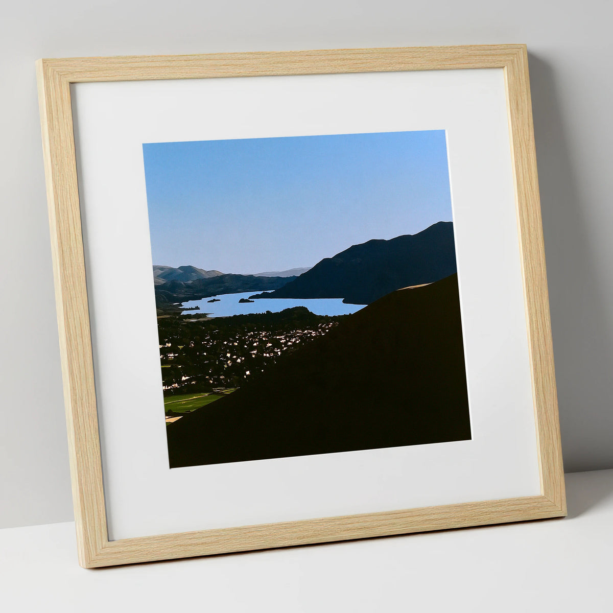 Keswick and Derwentwater in Silhouette lake district village art print in natural frame