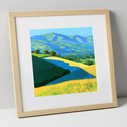 Sunlight and Cloud Shadows over Fells lake district sky art print in natural frame