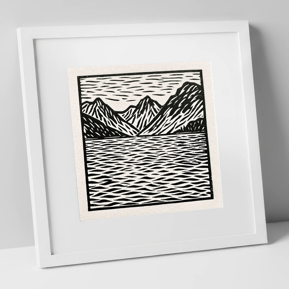 Monochrome Fells and Lake Reflections lake district lake art print in white frame