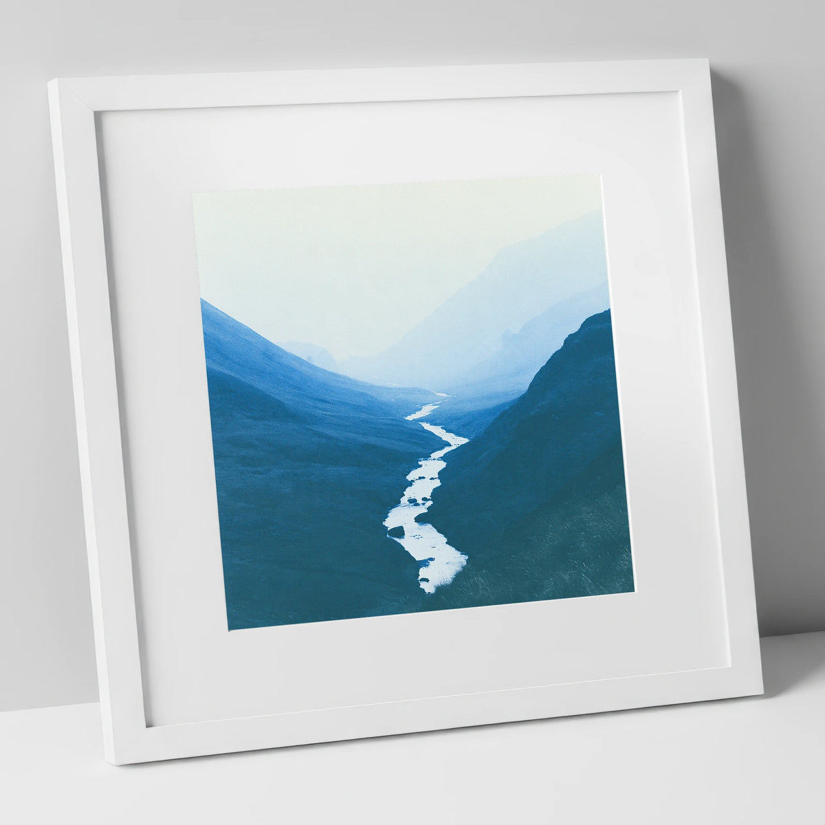 River Winding Through Blue Fells lake district waterfall art print in white frame